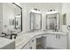 Bathroom featuring double vanities, granite counter tops, new hardware, and modern lighting at 531 Barcelona Dr, Poinciana, FL 34759