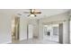 Bedroom with access to bathroom and sunroom, natural light, neutral walls and ceiling fan at 531 Barcelona Dr, Poinciana, FL 34759