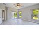 Bedroom featuring a sliding glass door to sunroom, natural light and neutral walls at 531 Barcelona Dr, Poinciana, FL 34759