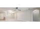 Large living area with tile floors, a modern ceiling fan, and easy access to other rooms at 531 Barcelona Dr, Poinciana, FL 34759