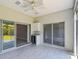 This sunroom features a wine cooler and access to the backyard and main house at 531 Barcelona Dr, Poinciana, FL 34759