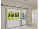 Bright sunroom features large sliding doors opening to the backyard, inviting natural light and outdoor views at 531 Barcelona Dr, Poinciana, FL 34759