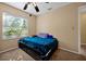 Bedroom featuring a ceiling fan, large window, and neutral colored walls at 541 Rebecca Dr, St Cloud, FL 34769