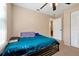Bedroom with a window view, closet, ceiling fan, and neutral colored walls at 541 Rebecca Dr, St Cloud, FL 34769