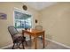 Cozy breakfast nook with a quaint table and chairs, bathed in natural light from a nearby window at 541 Rebecca Dr, St Cloud, FL 34769