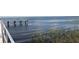 View of lake water and wetland grasses, from the edge of a public dock at 541 Rebecca Dr, St Cloud, FL 34769
