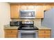 Bright kitchen with stainless steel appliances, granite counters, and ample cabinet space, perfect for cooking at 541 Rebecca Dr, St Cloud, FL 34769