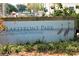 View of the Lakefront Park Sign with Lake, address, and local bird graphics at 541 Rebecca Dr, St Cloud, FL 34769