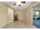 Living room with neutral color walls and tile floors with a view to the outside at 541 Rebecca Dr, St Cloud, FL 34769