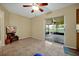 Living room with neutral color walls and tile floors with a view to the outside at 541 Rebecca Dr, St Cloud, FL 34769