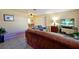 Comfortable living space featuring tile floors, a television, and ample seating, creating a cozy atmosphere at 541 Rebecca Dr, St Cloud, FL 34769