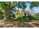 A charming shed is situated on the property, enveloped in lush greenery and complemented by mature trees at 541 Rebecca Dr, St Cloud, FL 34769