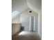 Bright bedroom featuring vaulted ceiling, skylight and closet space at 6148 Westgate Dr # 302, Orlando, FL 32835