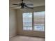 Bedroom with neutral walls, carpet, ceiling fan, and windows with blinds at 6148 Westgate Dr # 302, Orlando, FL 32835