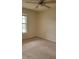 Bedroom featuring neutral walls, carpet, ceiling fan, and natural light from the window at 6148 Westgate Dr # 302, Orlando, FL 32835