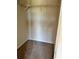 A carpeted closet with a wire shelf provides functional storage space at 6148 Westgate Dr # 302, Orlando, FL 32835