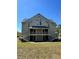 Two story exterior featuring double stairways, balconies, and neutral tone paint at 6148 Westgate Dr # 302, Orlando, FL 32835