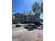 Well-maintained condo building featuring multiple stories, balconies, and convenient parking at 6148 Westgate Dr # 302, Orlando, FL 32835