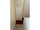 Hallway leading to staircase and door at 6148 Westgate Dr # 302, Orlando, FL 32835