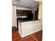 Modern kitchen featuring dark wood cabinets, black appliances, and sleek countertops at 6148 Westgate Dr # 302, Orlando, FL 32835
