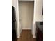 Convenient laundry area with washer and dryer located next to the kitchen with dark wood cabinets at 6148 Westgate Dr # 302, Orlando, FL 32835
