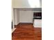 Open-concept living and kitchen area with high ceilings and hardwood floors throughout at 6148 Westgate Dr # 302, Orlando, FL 32835