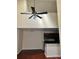 Spacious living and kitchen area with a high ceiling and a modern ceiling fan at 6148 Westgate Dr # 302, Orlando, FL 32835