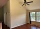 Spacious living room with hardwood floors, vaulted ceilings, and natural light at 6148 Westgate Dr # 302, Orlando, FL 32835