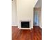 Cozy living room with hardwood floors and a classic fireplace for a comfortable ambiance at 6148 Westgate Dr # 302, Orlando, FL 32835