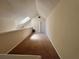 Spacious loft area features plush carpeting and ample natural light from a skylight at 6148 Westgate Dr # 302, Orlando, FL 32835