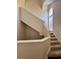 Well lit staircase leads to upper level at 6148 Westgate Dr # 302, Orlando, FL 32835