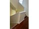 Carpeted stairway and hardwood floors leading up to the next level offer a neutral color scheme at 6148 Westgate Dr # 302, Orlando, FL 32835
