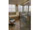 Bright bathroom featuring a soaking tub, tile flooring, and a glass-enclosed shower at 619 Tapatio Ln, Kissimmee, FL 34759