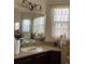 Bathroom featuring a vanity with solid surface countertop, decorative mirror, and lace curtains at 619 Tapatio Ln, Kissimmee, FL 34759