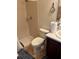 Bathroom features a walk in shower, toilet, vanity with sink, mirror, and bathroom accessories at 619 Tapatio Ln, Kissimmee, FL 34759