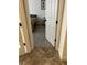 Bedroom view through doorway shows hardwood flooring and a neutral color scheme at 619 Tapatio Ln, Kissimmee, FL 34759
