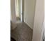 Hallway with hard wood flooring leads to a room; natural light at 619 Tapatio Ln, Kissimmee, FL 34759