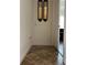 Hallway with decorative mirrors leads to another room with a seating area at 619 Tapatio Ln, Kissimmee, FL 34759