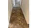 Hallway featuring tile flooring that leads to other rooms in the house at 619 Tapatio Ln, Kissimmee, FL 34759