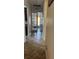 Bright hallway with tile flooring leading to French doors at 619 Tapatio Ln, Kissimmee, FL 34759