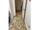Tiled hallway with a view of an open door that leads to other rooms at 619 Tapatio Ln, Kissimmee, FL 34759