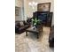 Spacious living room with plush leather furniture, stylish decor and a large entertainment center at 619 Tapatio Ln, Kissimmee, FL 34759