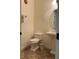 Powder room featuring a decorative sink and toilet at 619 Tapatio Ln, Kissimmee, FL 34759