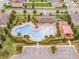 Aerial view of community pool, splashpad, playground and parking at 709 Blackstone St, Minneola, FL 34715