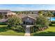 Community clubhouse featuring lush landscaping, gated entry, and pool views at 709 Blackstone St, Minneola, FL 34715