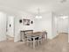 Bright dining room with a wine cabinet and neutral color palette at 709 Blackstone St, Minneola, FL 34715