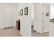 Hallway view into a home interior with tile flooring and white walls leading into a bedroom at 709 Blackstone St, Minneola, FL 34715