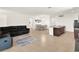 Spacious open-concept layout featuring living room, dining area, and kitchen with breakfast bar at 709 Blackstone St, Minneola, FL 34715