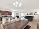 Bright, open floor plan showcases an eat-in kitchen, dining space, and living area at 709 Blackstone St, Minneola, FL 34715