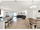 Open concept home featuring breakfast bar seating, a dining area, and comfortable living area at 709 Blackstone St, Minneola, FL 34715